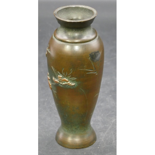 695 - A Japanese bronze round bulbous thin necked trumpet shaped vase with raised bird, floral and leaf de... 