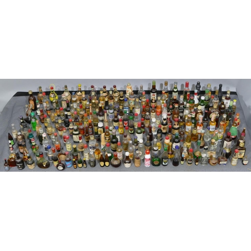 698 - A large quantity of various miniature liqueur bottles etc