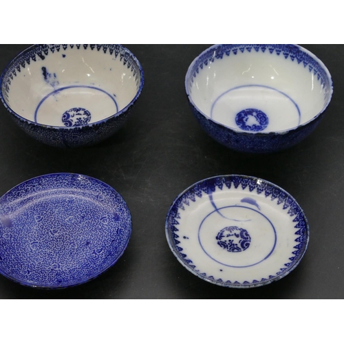 70 - 2 Oriental round lidded bowls on blue and white ground, 11cm diameter. (4)