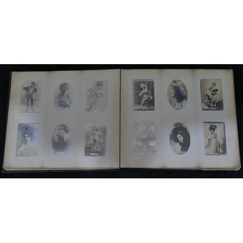 703 - An Ogden's photo album containing black and white cards of various ladies and a set of various milit... 