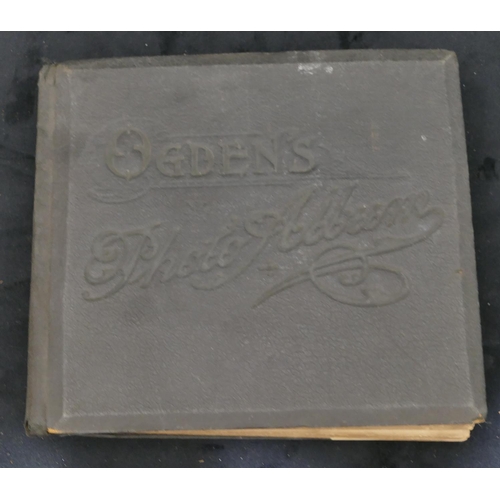 703 - An Ogden's photo album containing black and white cards of various ladies and a set of various milit... 