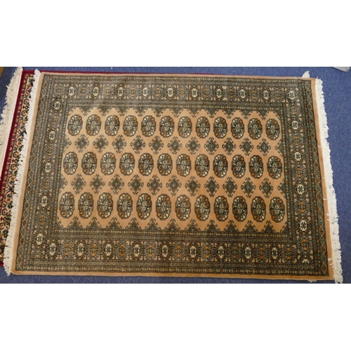 710 - A modern Eastern knotted rug on cream ground with 3 x 12 centre medallions, 181cm x 127cm