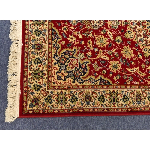 711 - A modern Persian rug on cream and blue ground with centre medallion, 185cm x 126cm