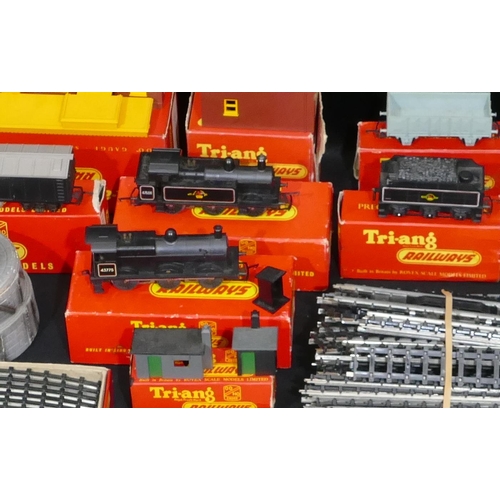 715 - 2 Tri-ang engines boxed, a quantity Tri-ang trucks, coaches and track etc., some boxed, a Meccano st... 