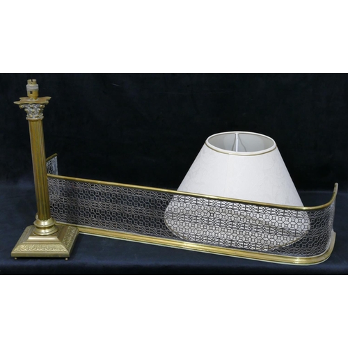 723 - A brass and silvered metal fire fender with pierced decoration, 101.5cm long, a brass Corinthian col... 