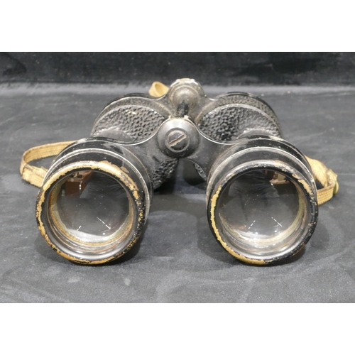 725 - A pair of Bino prism number 5 mk III x 7 binoculars, dated 1941, in fitted leather case.