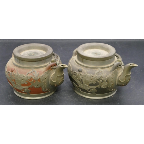 74 - 2 Chinese Yinxing clay round bulbous shaped teapots with pewter overlay depicting dragons, both labe... 