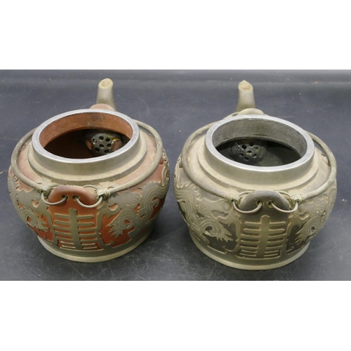 74 - 2 Chinese Yinxing clay round bulbous shaped teapots with pewter overlay depicting dragons, both labe... 