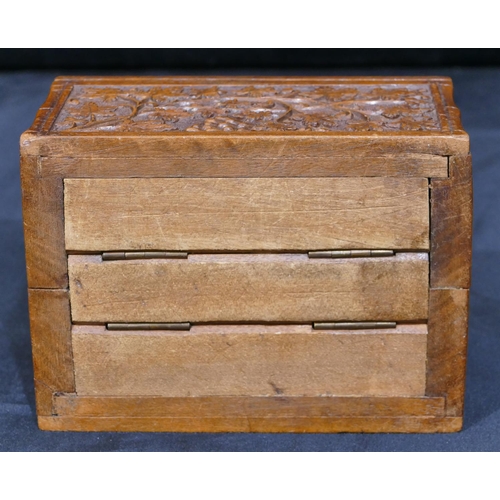 741 - A carved wooden rectangular shaped box with raised grape and vine decoration, hinged lid, 15cm wide