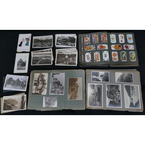 750 - A postcard and photograph album, a small quantity of loose postcards and an album of cigarette cards