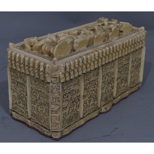 762 - A resin rectangular shaped box with cover, allover Oriental figure decoration, 30cm wide, 16cm high.