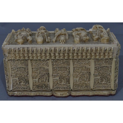 762 - A resin rectangular shaped box with cover, allover Oriental figure decoration, 30cm wide, 16cm high.