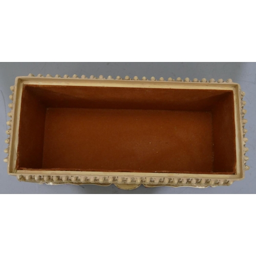 762 - A resin rectangular shaped box with cover, allover Oriental figure decoration, 30cm wide, 16cm high.