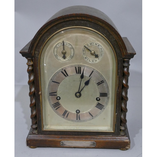 772 - A Mappin and Webb 1920's oak 8-day striking Westminster chime arch topped mantel clock with barley t... 