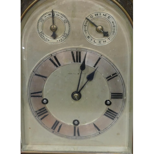 772 - A Mappin and Webb 1920's oak 8-day striking Westminster chime arch topped mantel clock with barley t... 