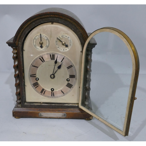 772 - A Mappin and Webb 1920's oak 8-day striking Westminster chime arch topped mantel clock with barley t... 