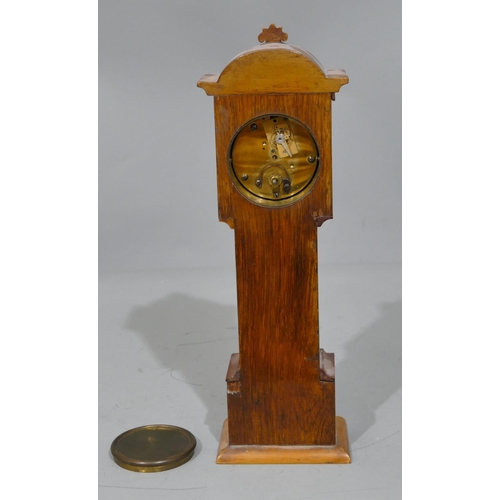 773 - A miniature table top longcase clock with allover marquetry and inlaid decoration, cream chapter rin... 