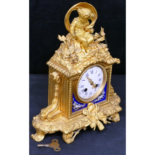 781 - A Vincenti ormolu 8-day striking mantel clock with cupid motif to top holding 2 fish seated in a she... 