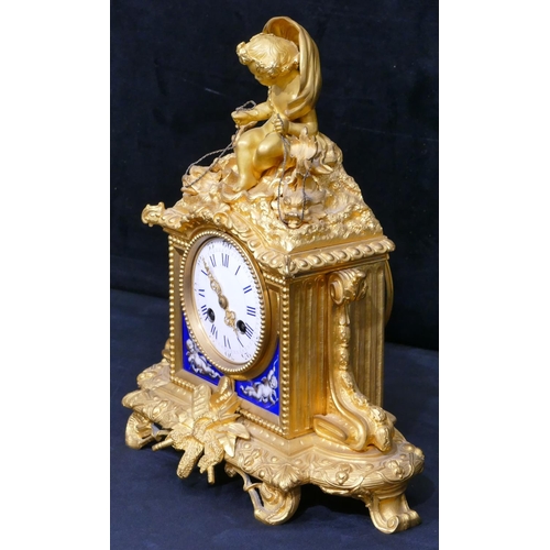 781 - A Vincenti ormolu 8-day striking mantel clock with cupid motif to top holding 2 fish seated in a she... 