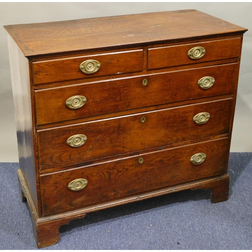 787 - A 19th Century oak straight front chest of drawers, 2 short and 3 long graduated drawers with drop b... 