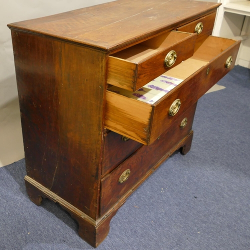 787 - A 19th Century oak straight front chest of drawers, 2 short and 3 long graduated drawers with drop b... 