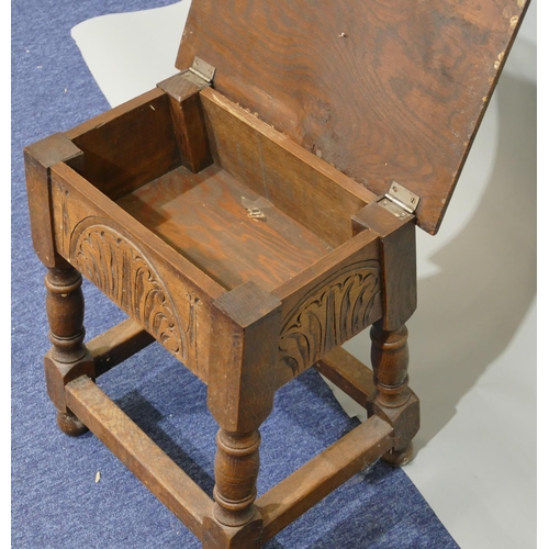 791 - An oak rectangular shaped stool with hinged seat, carved frieze on round turned legs with stretchers... 