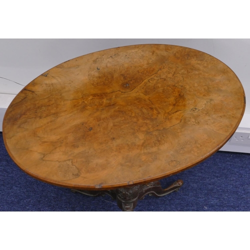 795 - A Victorian burr walnut oval occasion table on turned stem with 3 splayed legs and carved decoration... 