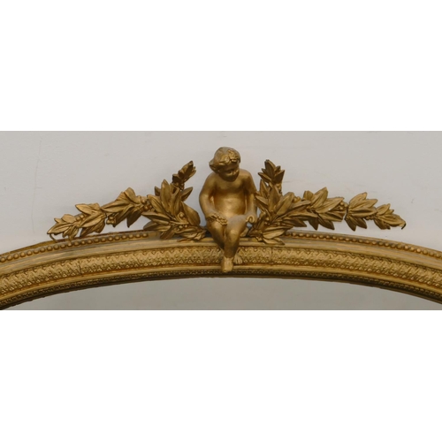 796 - A gilt hanging arched topped over mantel with raised figure, leaf and berry decoration, scroll sides... 