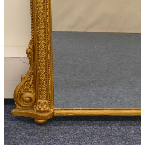 796 - A gilt hanging arched topped over mantel with raised figure, leaf and berry decoration, scroll sides... 