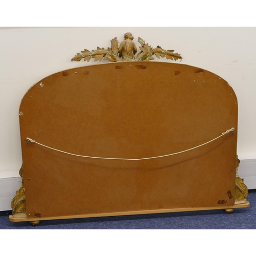 796 - A gilt hanging arched topped over mantel with raised figure, leaf and berry decoration, scroll sides... 