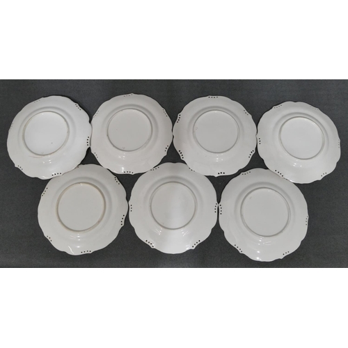 8 - A set of 7 19th Century round scallop shaped plates on white and cream ground with various hand pain... 