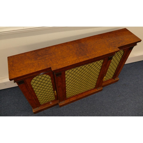 807 - A 19th Century burr maplewood break front low sideboard with carved scroll mounts, centre brass fret... 