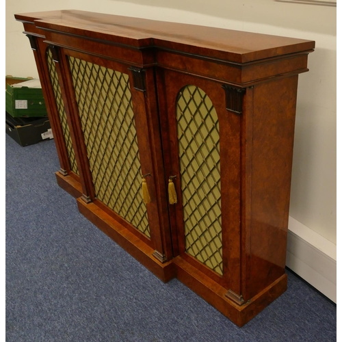 807 - A 19th Century burr maplewood break front low sideboard with carved scroll mounts, centre brass fret... 