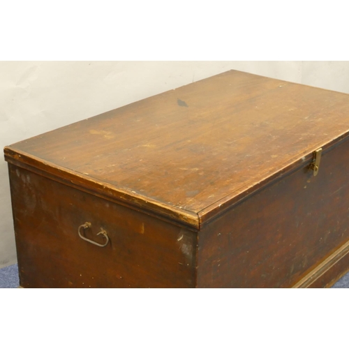 817 - A 19th Century mahogany rectangular shaped trunk with wrought iron carrying handles, hinged lid encl... 