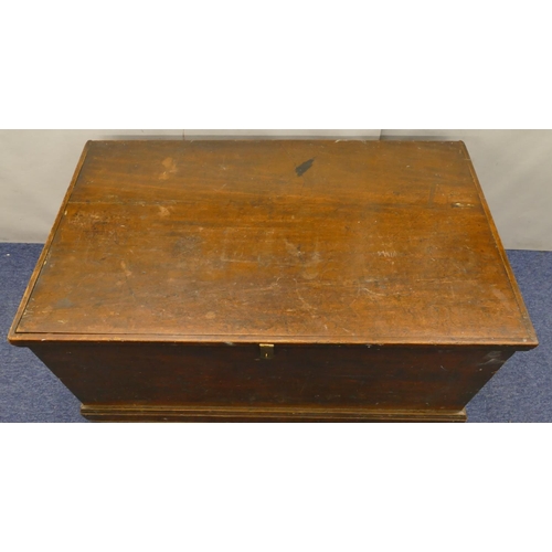 817 - A 19th Century mahogany rectangular shaped trunk with wrought iron carrying handles, hinged lid encl... 