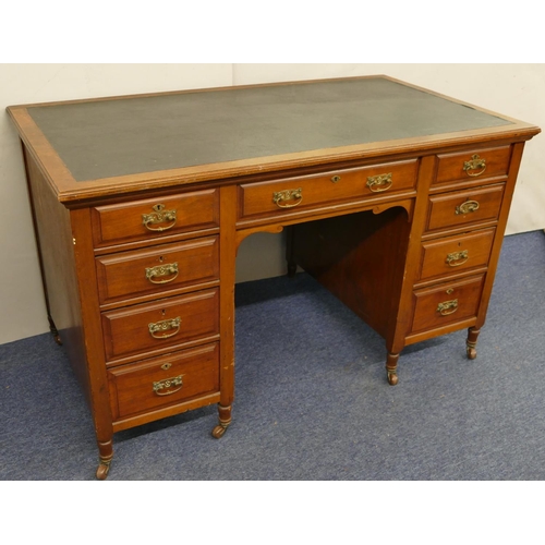 825 - A Victorian walnut knee hole desk with inset top, centre drawer flanked by 8 short graduated drawers... 