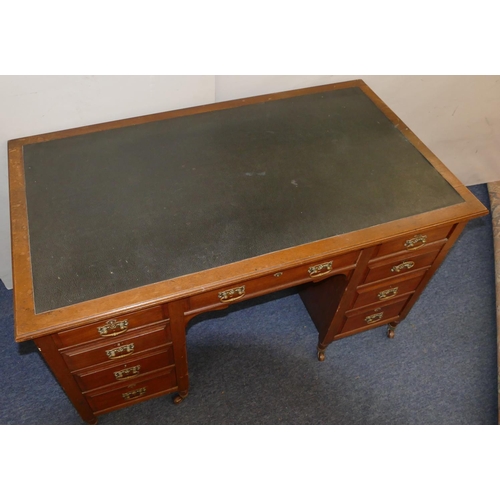 825 - A Victorian walnut knee hole desk with inset top, centre drawer flanked by 8 short graduated drawers... 