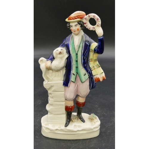 84 - A 19th Century Staffordshire figure of a standing gentleman  standing on a plinth and holding a wrea... 