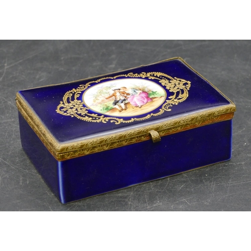 98 - A porcelain Limoges style rectangular shaped box on blue ground with gilt mounts and circular panel ... 