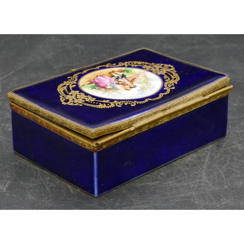 98 - A porcelain Limoges style rectangular shaped box on blue ground with gilt mounts and circular panel ... 