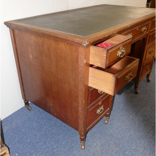 825 - A Victorian walnut knee hole desk with inset top, centre drawer flanked by 8 short graduated drawers... 