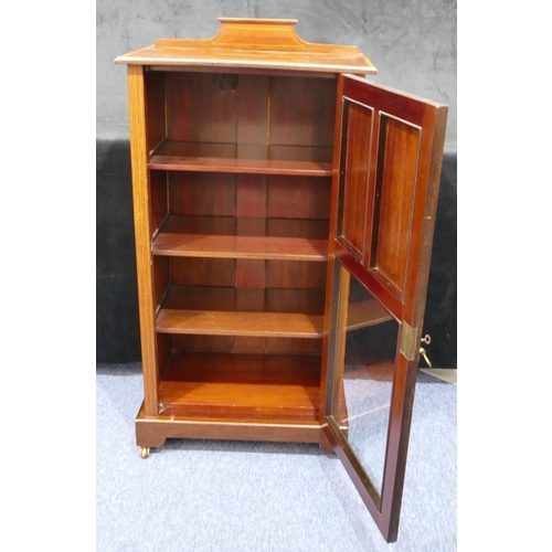 821 - An Edwardian mahogany music cabinet with allover inlaid banding and stringing, lipped back, single t... 