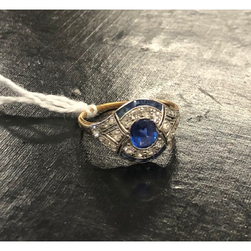 482 - An Art Deco gold ladies ring set with centre sapphire and surrounded by 24 diamonds and 12 further s... 