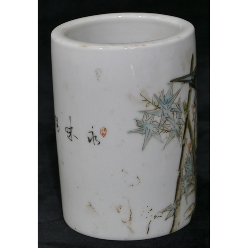 101 - An Oriental cylindrical brush pot on white ground with multi-coloured perched bird, floral and inscr... 