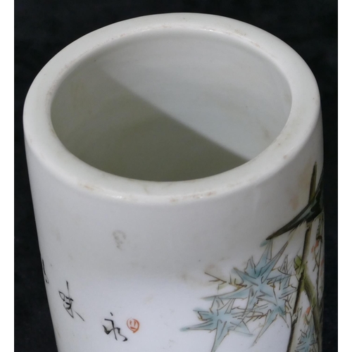 101 - An Oriental cylindrical brush pot on white ground with multi-coloured perched bird, floral and inscr... 