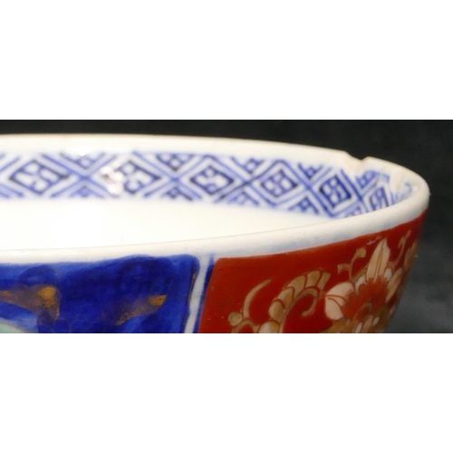 107 - An Imari round bowl on white, red and blue ground with floral, leaf and gilt decoration, 15.2cm diam... 