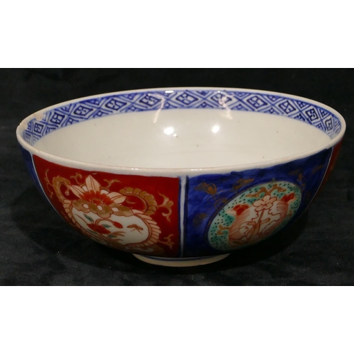 107 - An Imari round bowl on white, red and blue ground with floral, leaf and gilt decoration, 15.2cm diam... 