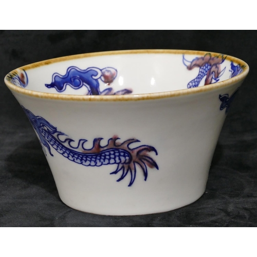 110 - A Chinese blue and white round trumpet shaped bowl with dragon and red decoration, labelled to base ... 