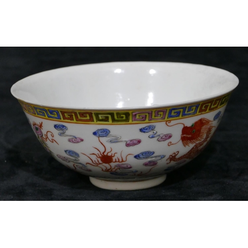 111 - A Chinese round trumpet shaped bowl on white ground with multi-coloured dragon and phoenix decoratio... 