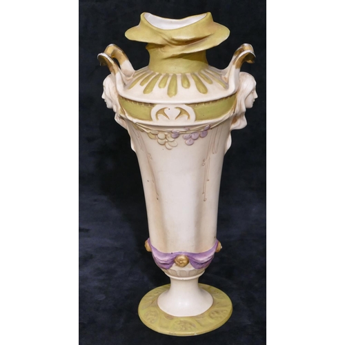 124 - A Royal Dux Art Nouveau round bulbous thin necked 2-handled vase with raised figureheads of ladies w... 